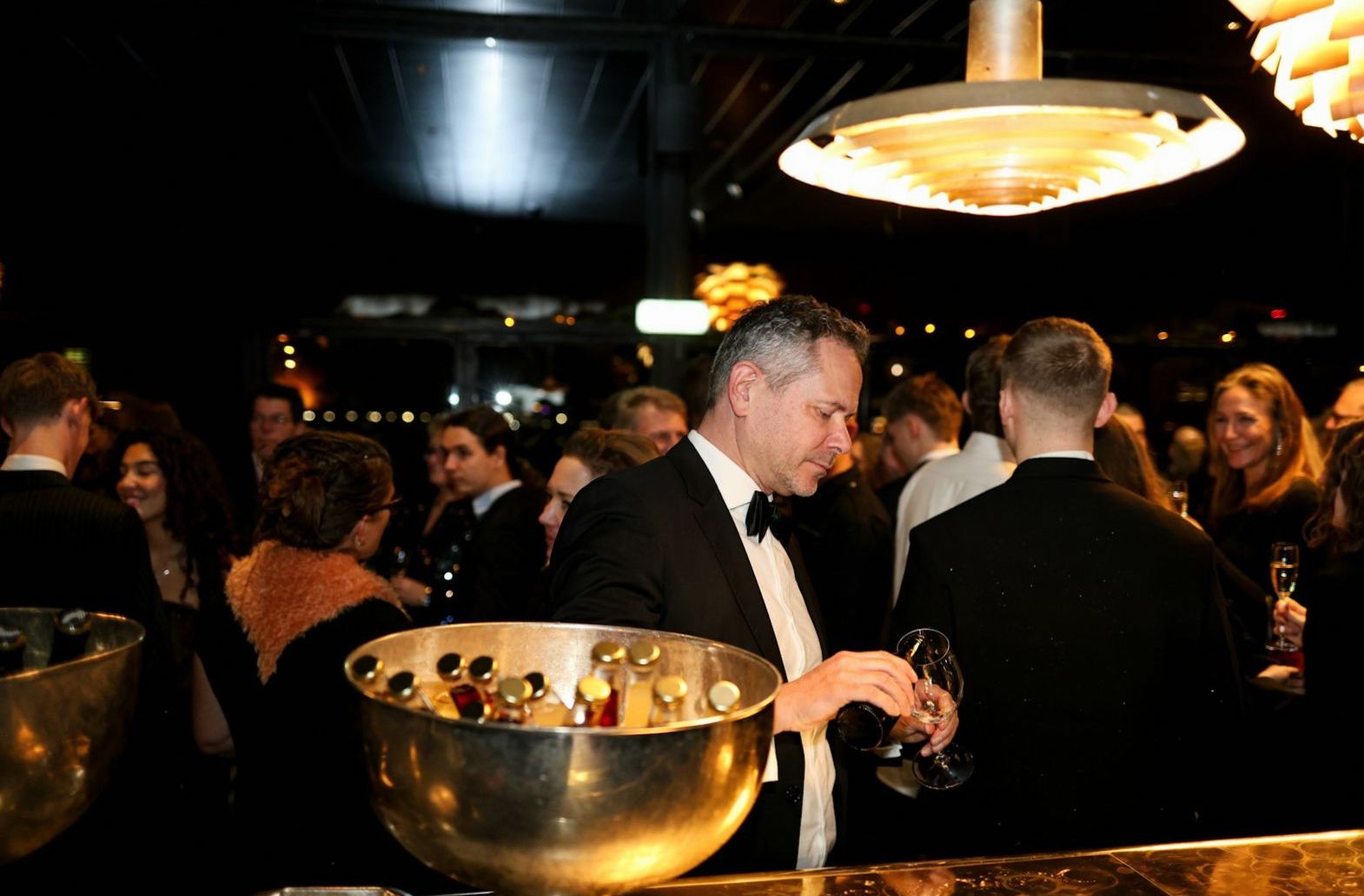 Guests gathering in an elegant evening event space